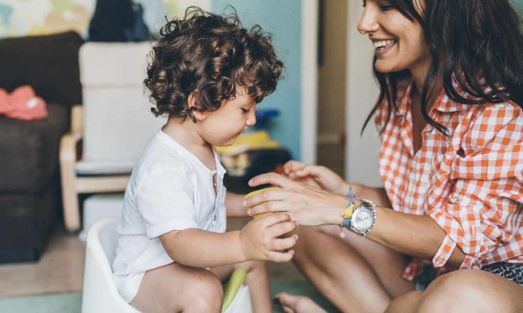 Mother with baby toddler potty training