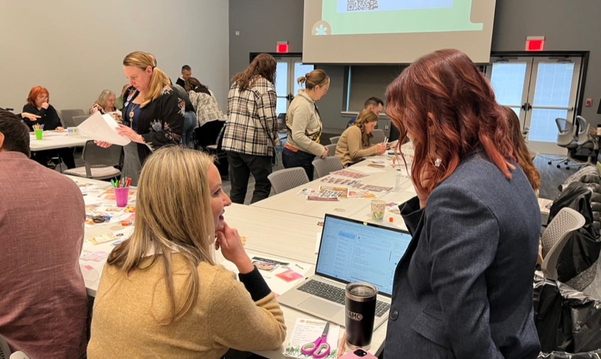 Professionals collaborate during a workshop at Velocity Macomb County, a hub for business innovation and community growth.