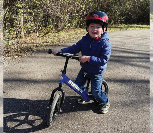 Young Boy from the Leising Family Riding his Bicycle enjoying YMCA Membership Benefits