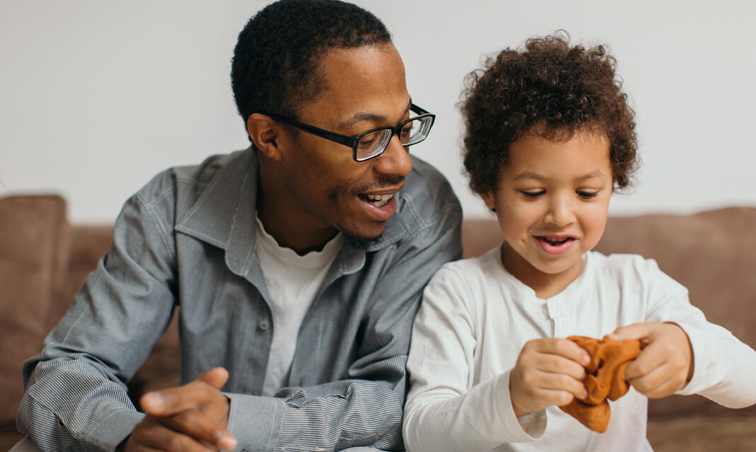 Father and child playing