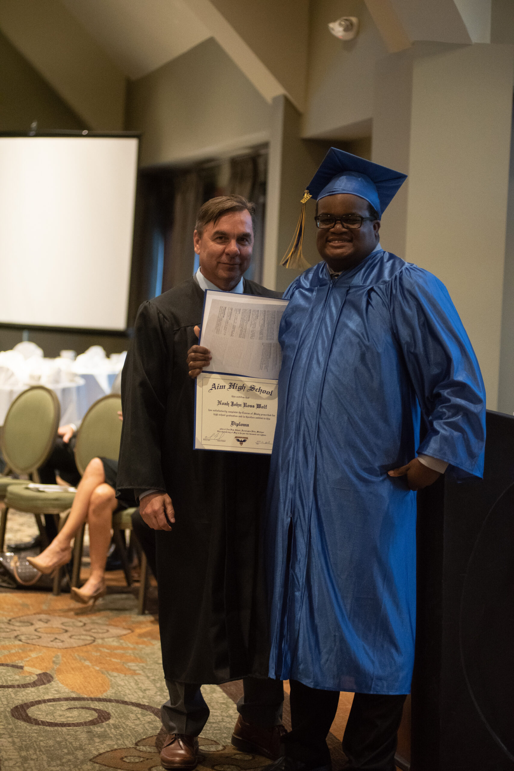 Noah Wolf with Mr Earls at Aim High School