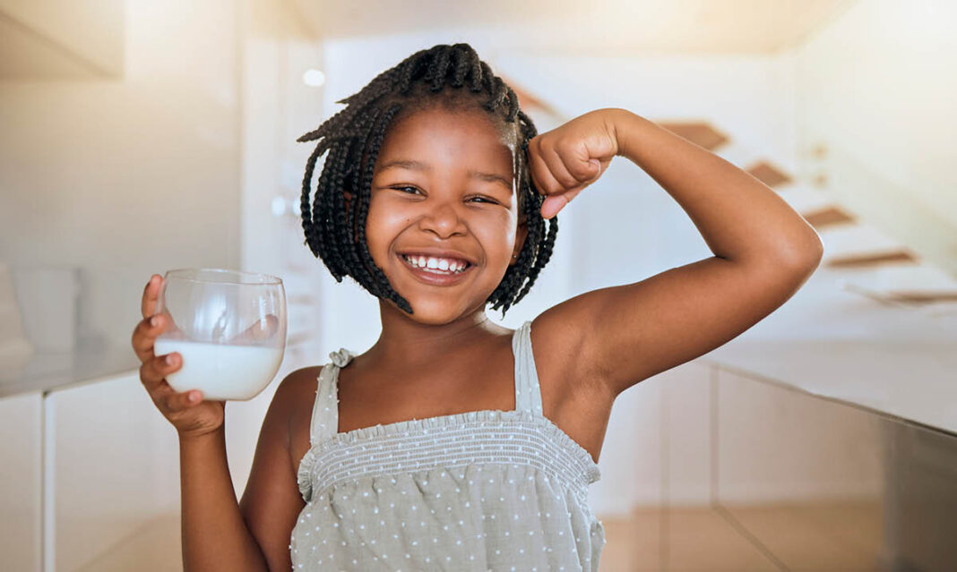 Girl drinking milk at home