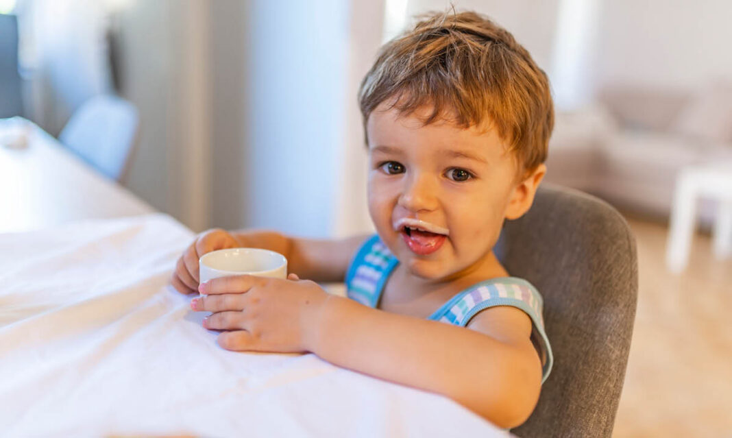 Little boy drinking milk
