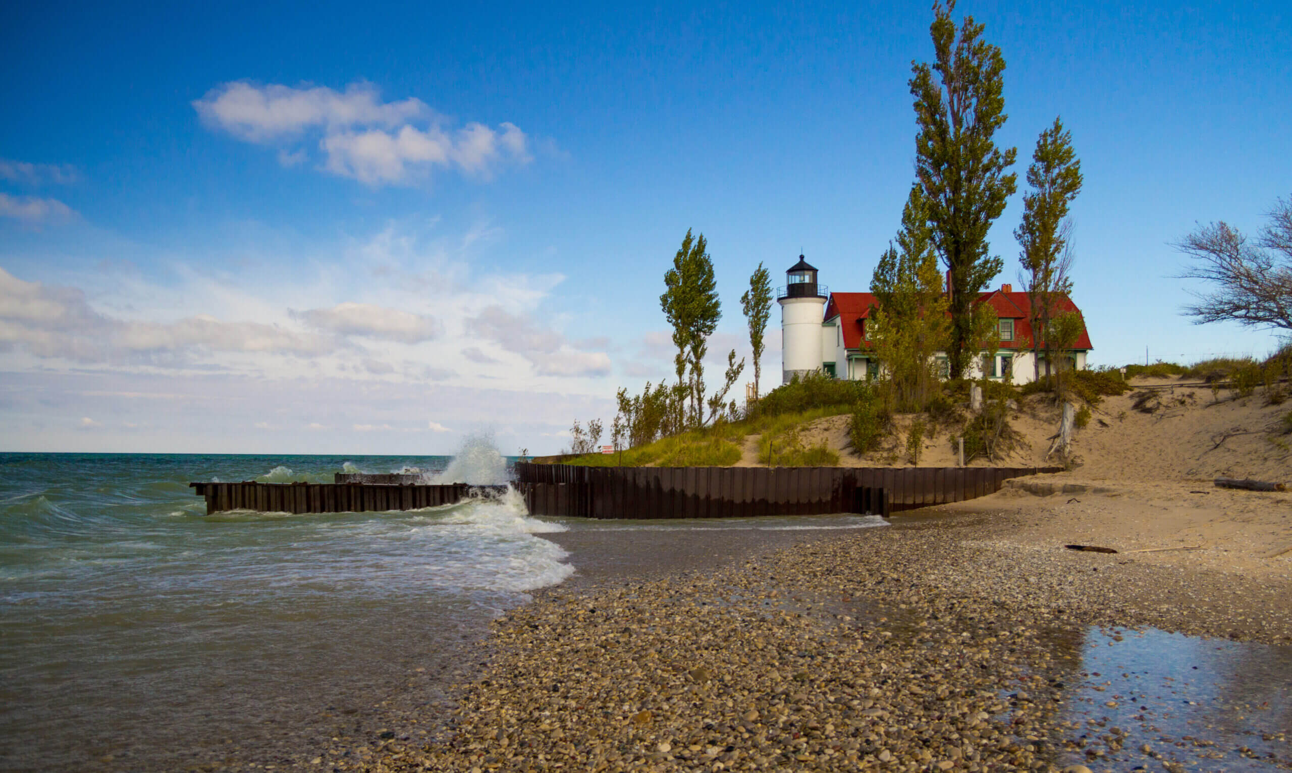 The historic Point Betsie Lighthouse on the coast of Lake Michigan on a windy day