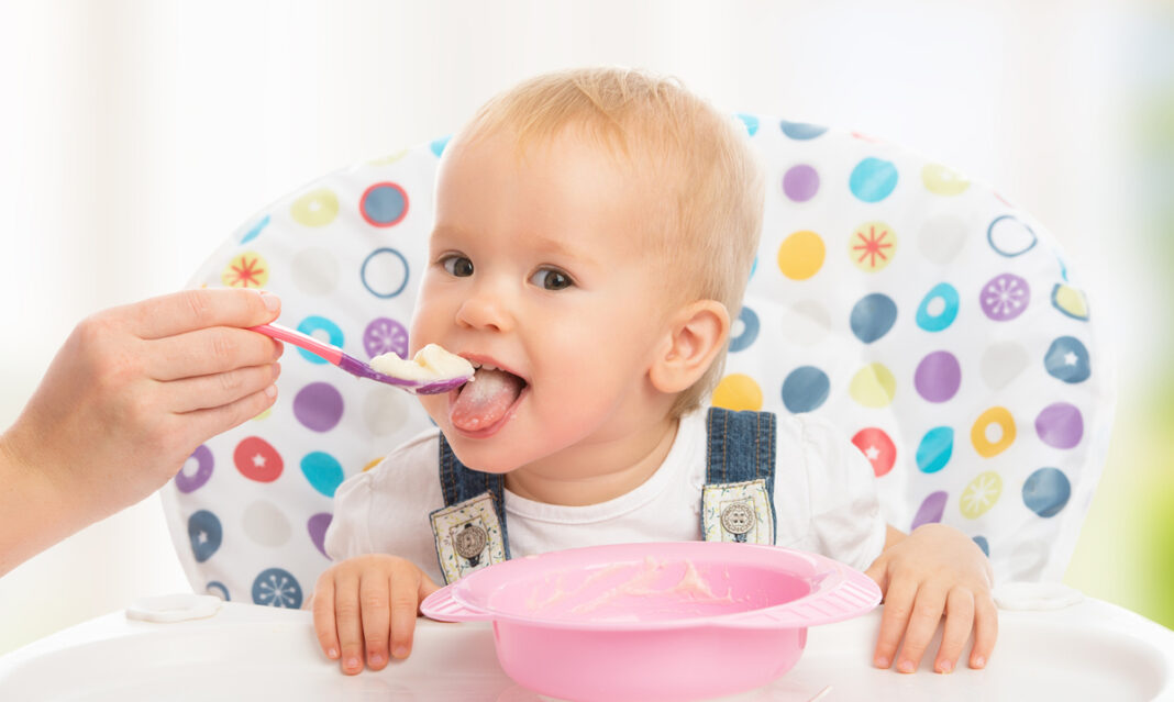 Baby taking first bites