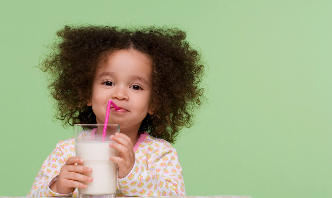 Little girl drinking milk