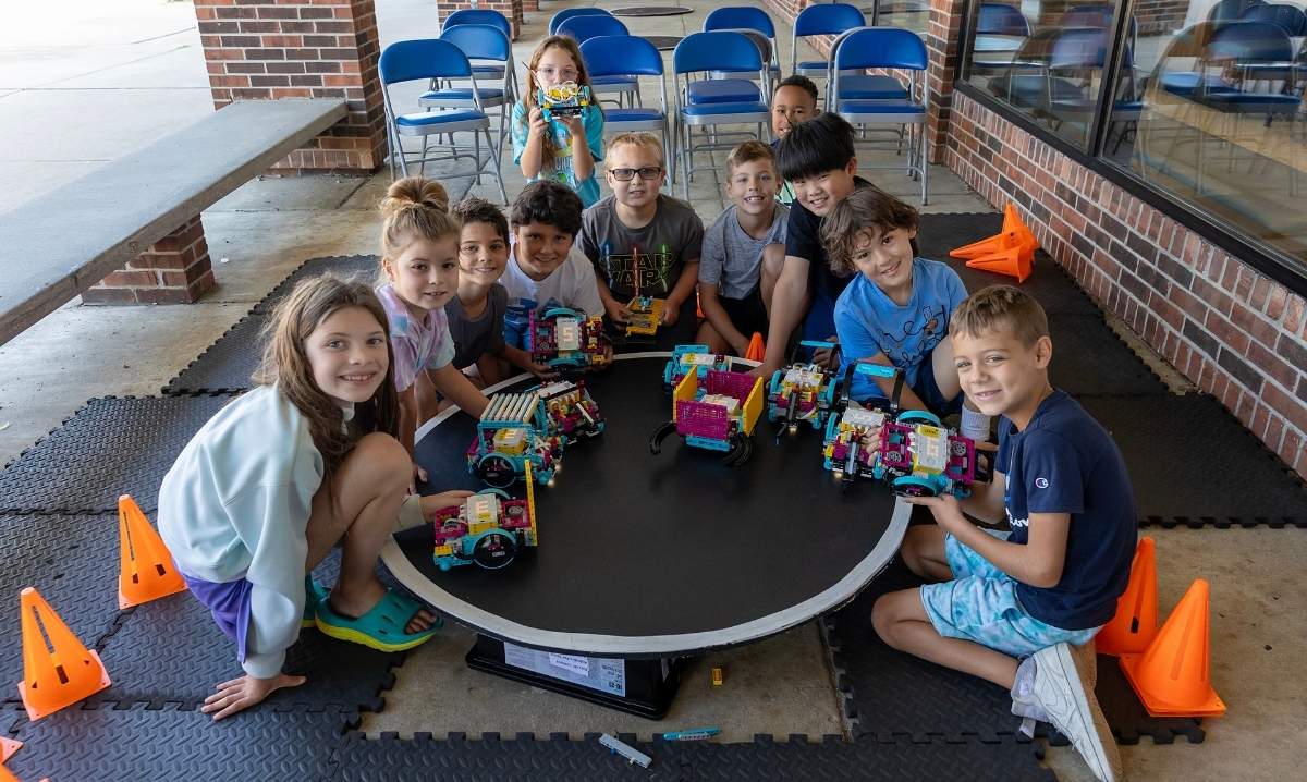 Elementary students participate in a robotics activity during Kids on Campus summer camp at Schoolcraft College.