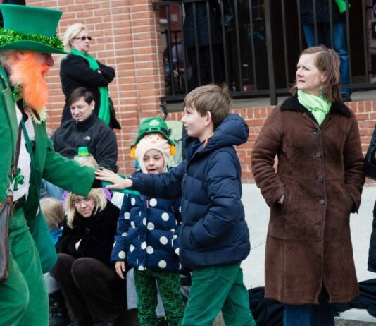 Families celebrate at the Royal Oak St Patrick’s Day Parade with kids meeting a leprechaun and enjoying a festive Irish community event