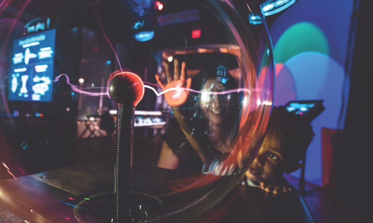 Children explore a hands-on science exhibit at a Lansing recreation center, a great spring break activity.