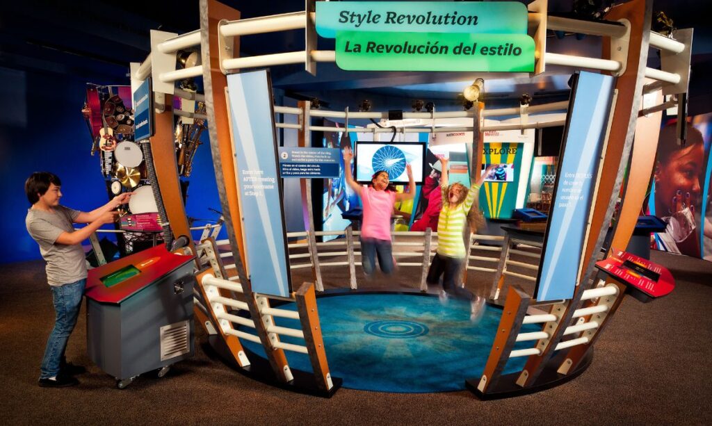 Kids jumping inside the Style Revolution exhibit at Sloan Museum’s 2theXTREME – MathAlive!, one of the exciting new spring exhibits in metro Detroit.