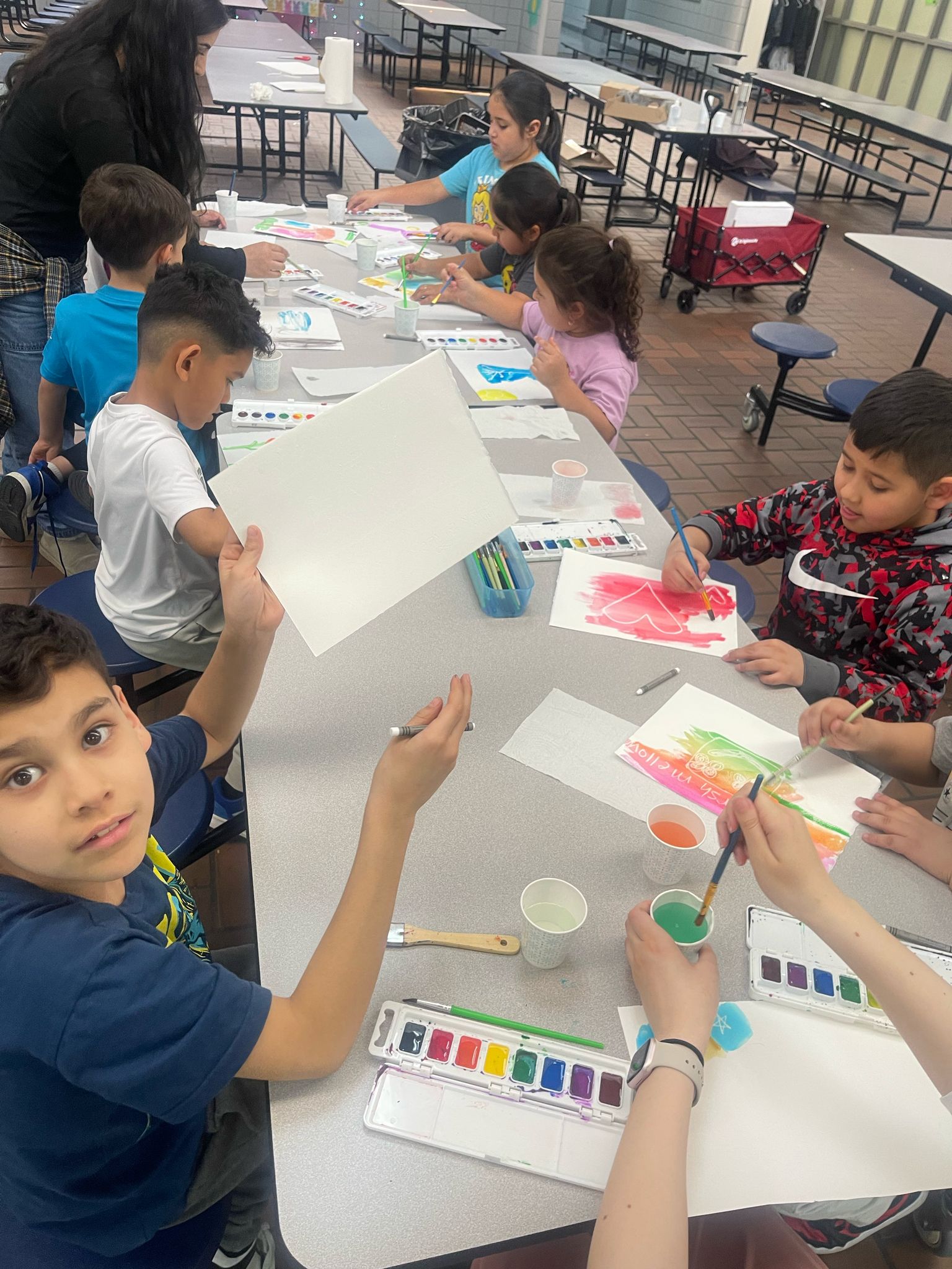 Students painting with watercolors during after-school art class at The Dearborn Academy, a Michigan charter school.