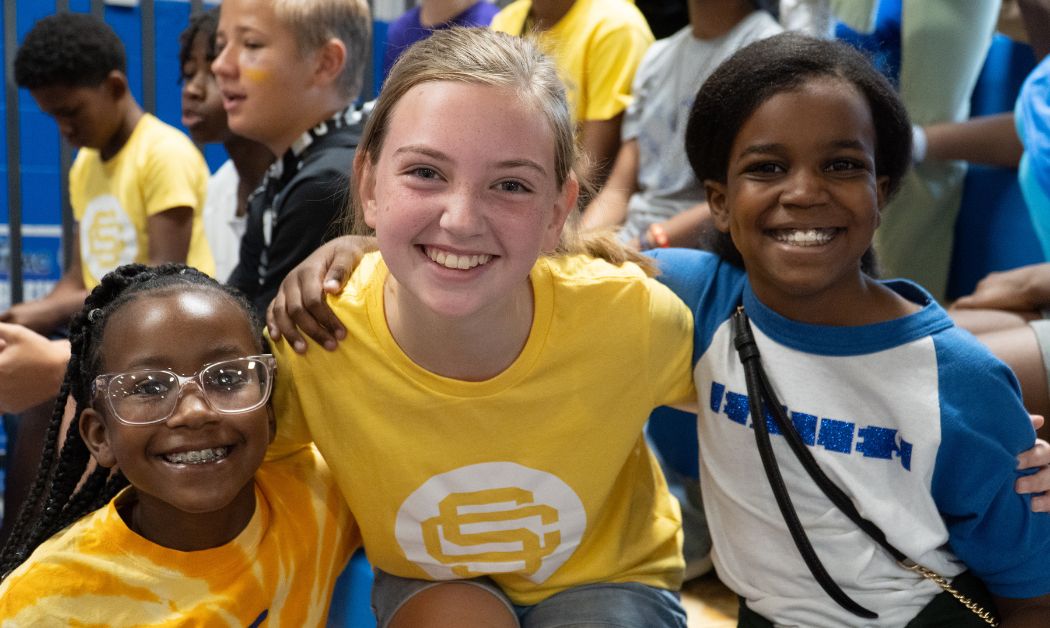 Smiling students at Southfield Christian School in Metro Detroit show school spirit during a student event, representing one of the area’s best schools.
