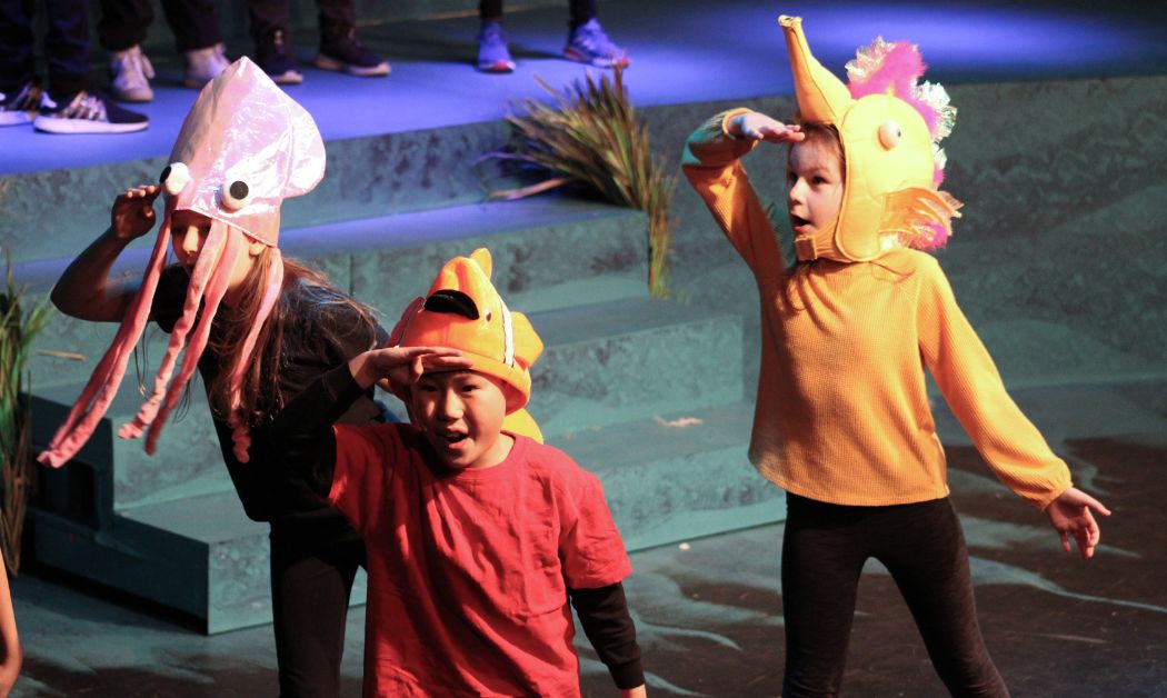 Young students from The Roeper School in Metro Detroit perform in a colorful underwater-themed play, showcasing the school’s strong arts and creative programs.