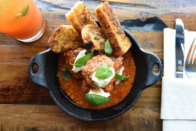 Delicious Italian meatballs with grilled bread at The Flying Noodle, a top family-friendly restaurant in Traverse City.
