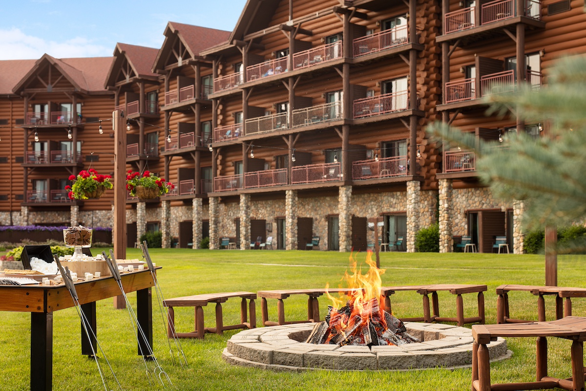 Outdoor bonfire pit with s’mores setup at Great Wolf Lodge in Traverse City, offering a cozy family-friendly evening activity.