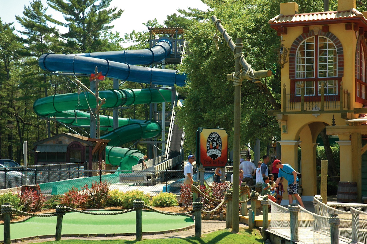 Families enjoying mini-golf and waterslides at Pirate’s Cove Adventure Park in Traverse City, Michigan — a top family-friendly attraction for kids and parents alike.