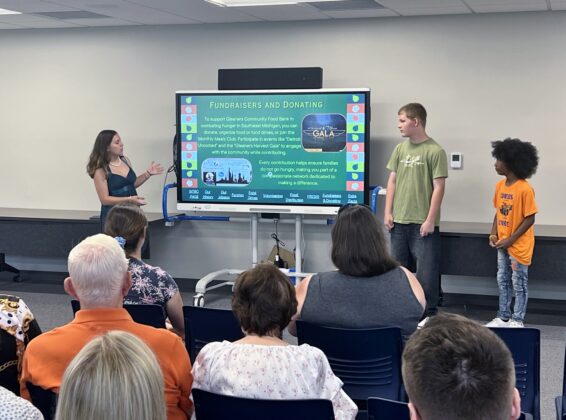 Academy Explorer 6 students present fundraising and donation ideas for Gleaners Community Food Bank, promoting community support to fight hunger in Southeast Michigan.