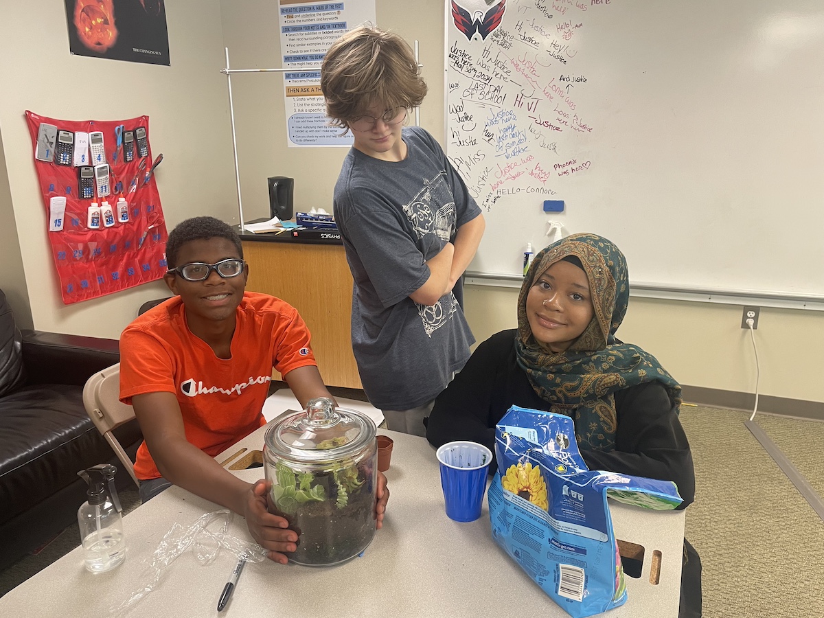 Students at Aim High School working together on a hands-on terrarium project, showcasing inclusive special education accommodations and engaging learning activities.
