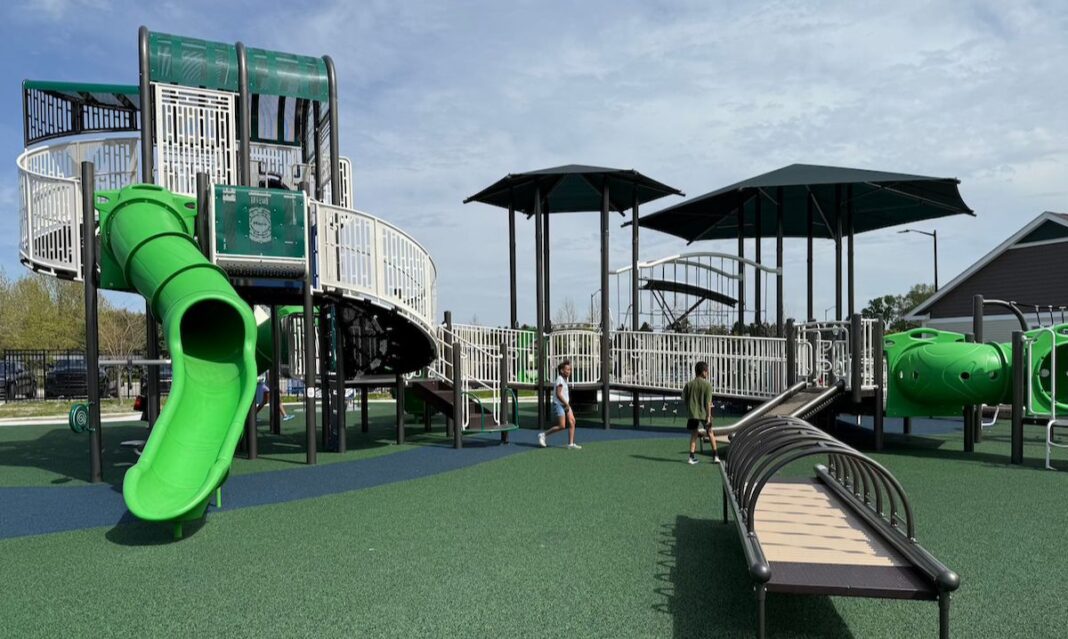 Clinton Township inclusive playground with accessible ramps, shaded structures, tube slides, and adaptive play equipment for kids of all abilities.