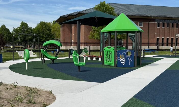 Colorful sensory play structures and adaptive equipment at Clinton Township inclusive playground, designed for accessible, engaging fun for children of all abilities.