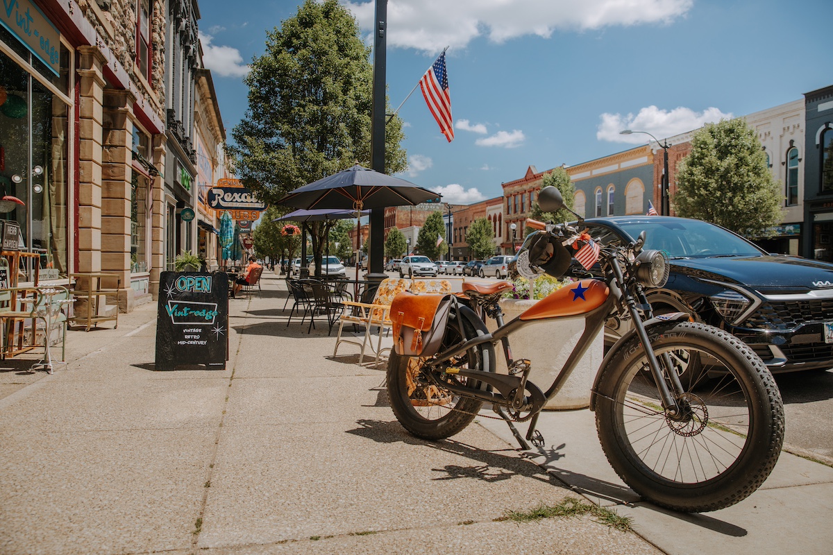 Historic downtown Marshall, Michigan, one of the top Michigan summer vacation day trip destinations, featuring vintage shopping, outdoor dining, and Americana charm