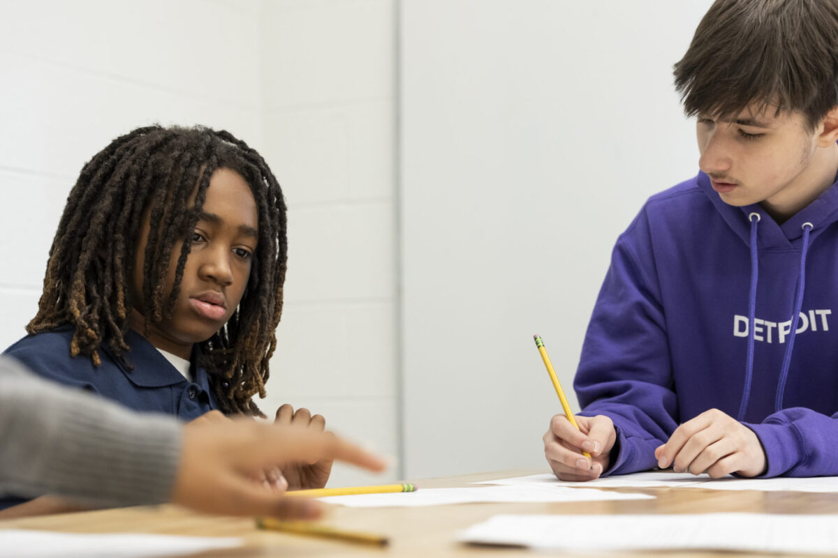 Detroit Achievement Academy students working together during a planning session for their student-designed park project