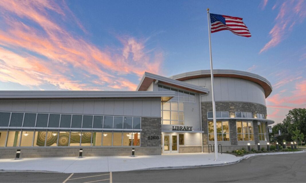 Modern exterior view of Shelby Township Library at sunset, one of the best libraries in Macomb County for families and community resources.