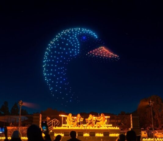 DroneArt Show Performance A drone light show forms a glowing bird in the night sky above a live string quartet performance in Detroit.