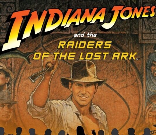 Indiana Jones and the Raiders of the Lost Ark Live in Concert Promotional poster for Indiana Jones and the Raiders of the Lost Ark Live in Concert with the Flint Symphony Orchestra, showing Indiana Jones artwork with silhouettes of the orchestra and the date Feb. 28.