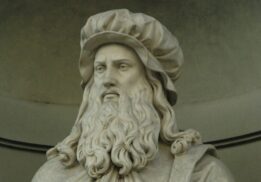 Statue of Leonardo da Vinci featured in DaVinci The Exhibition at Henry Ford Museum showcasing art science and inventions.