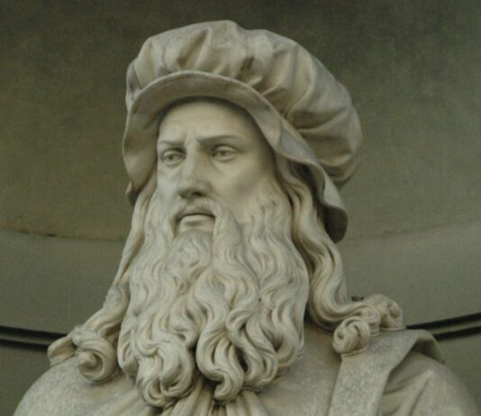 Statue of Leonardo da Vinci featured in DaVinci The Exhibition at Henry Ford Museum showcasing art science and inventions.