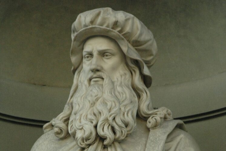 Statue of Leonardo da Vinci featured in DaVinci The Exhibition at Henry Ford Museum showcasing art science and inventions.