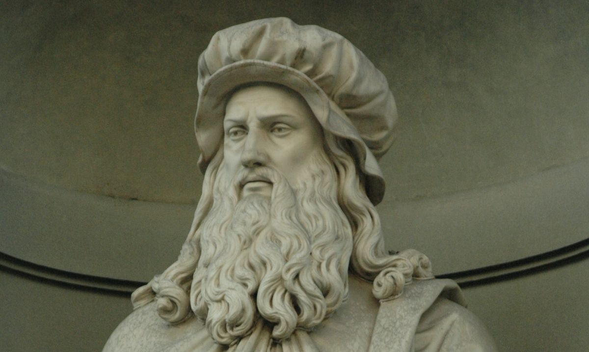 Statue of Leonardo da Vinci featured in DaVinci The Exhibition at Henry Ford Museum showcasing art science and inventions.