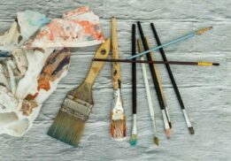 Paintbrushes and art supplies representing creativity at the Detroit Institute of Arts Contemporary Anishinaabe Art exhibition