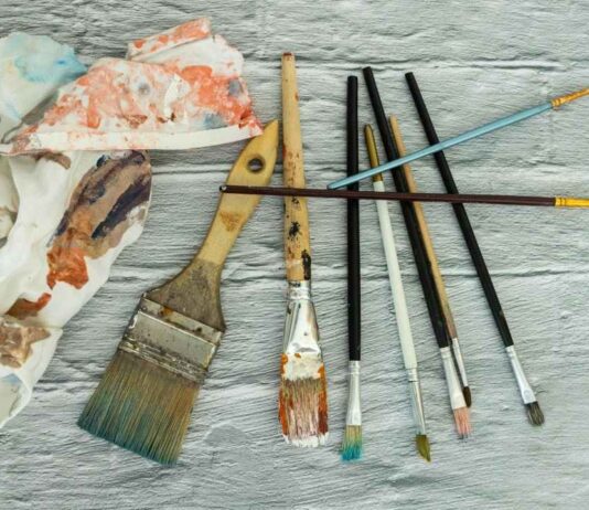 Paintbrushes and art supplies representing creativity at the Detroit Institute of Arts Contemporary Anishinaabe Art exhibition