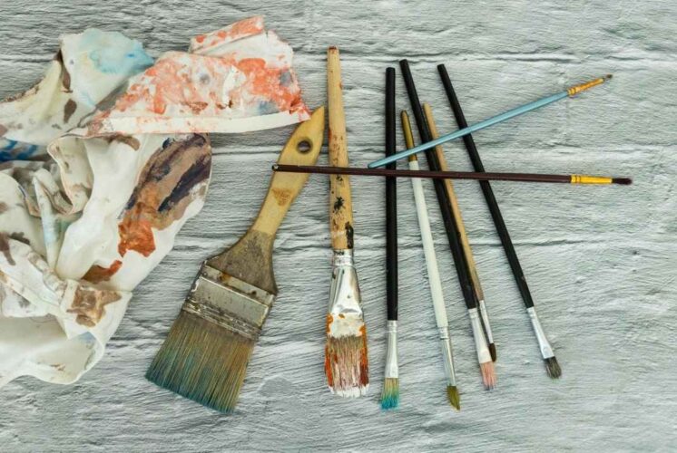 Paintbrushes and art supplies representing creativity at the Detroit Institute of Arts Contemporary Anishinaabe Art exhibition