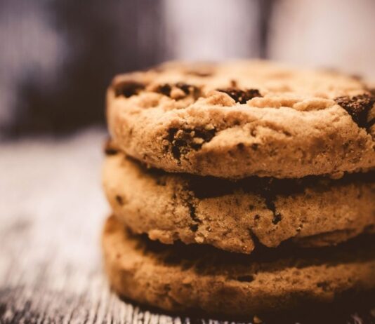 Stack of chocolate chip cookies representing the Royal Oak Cookie Crawl where families collect handcrafted cookies from local shops