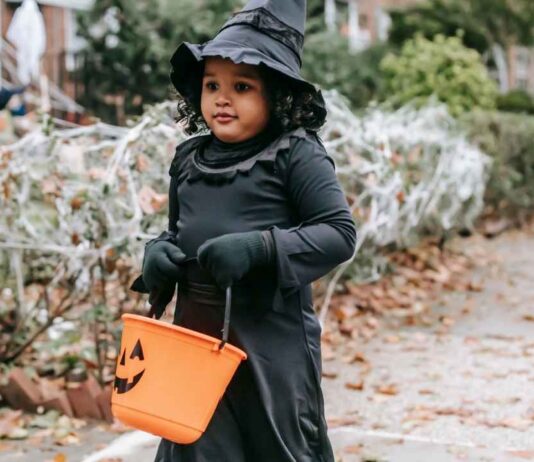 Animal Haunts at Leslie Science & Nature Center Child in witch costume at Animal Haunts Leslie Science & Nature Center Halloween event in Ann Arbor.