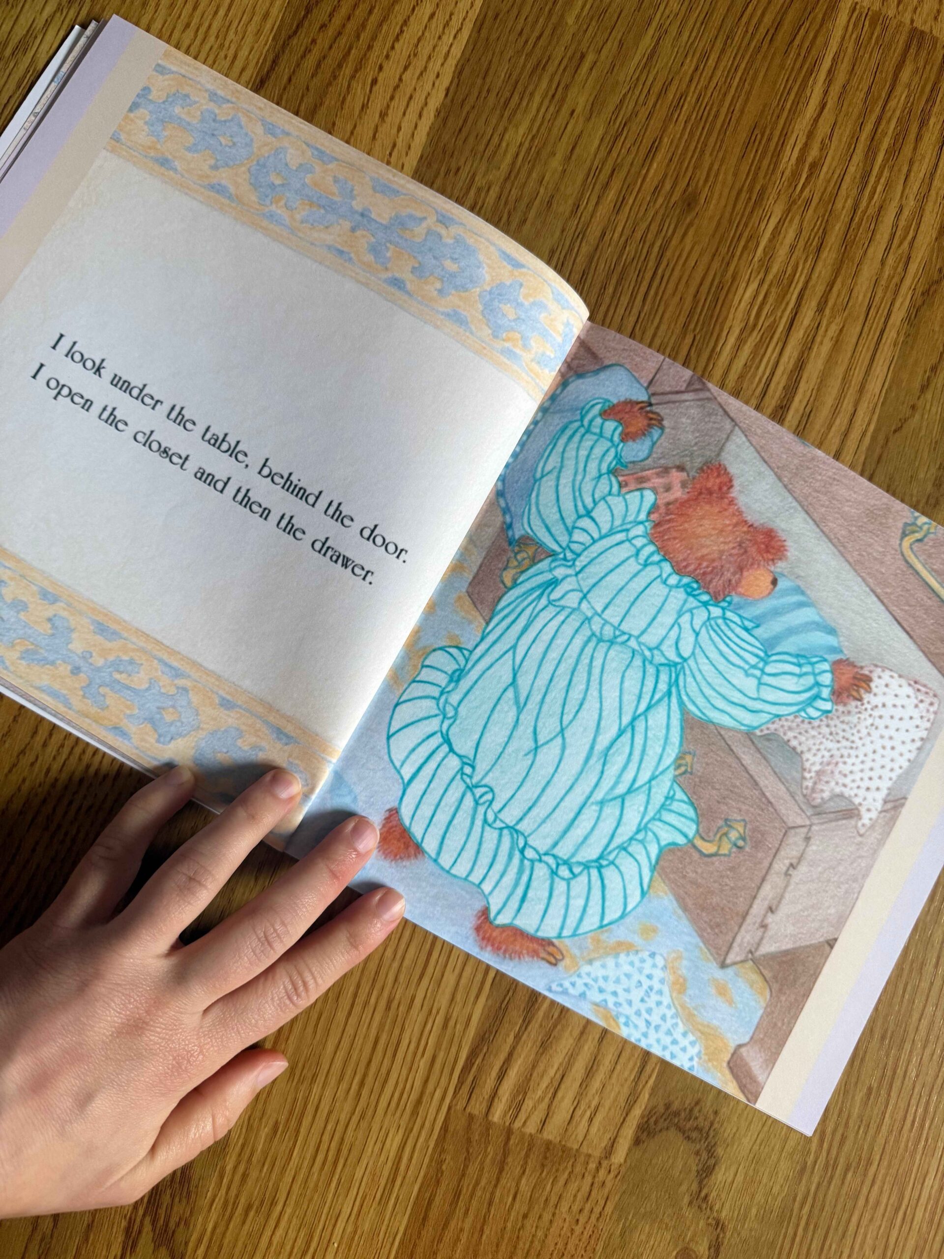 Page from Julie Stitt’s Hide and Seek children’s book showing a child searching in a room, illustrating playful learning through reading.
