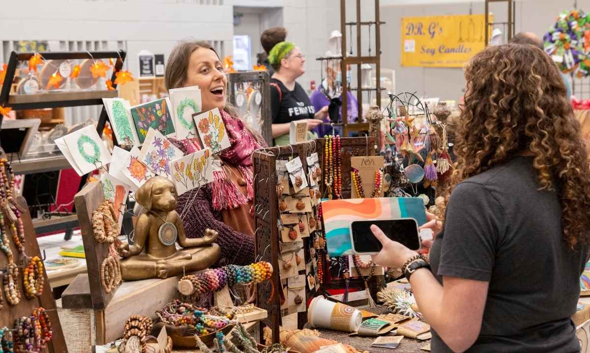 Shoppers browse handmade crafts, art, and jewelry at the Michigan Makers Market at The Hawk in Farmington Hills.