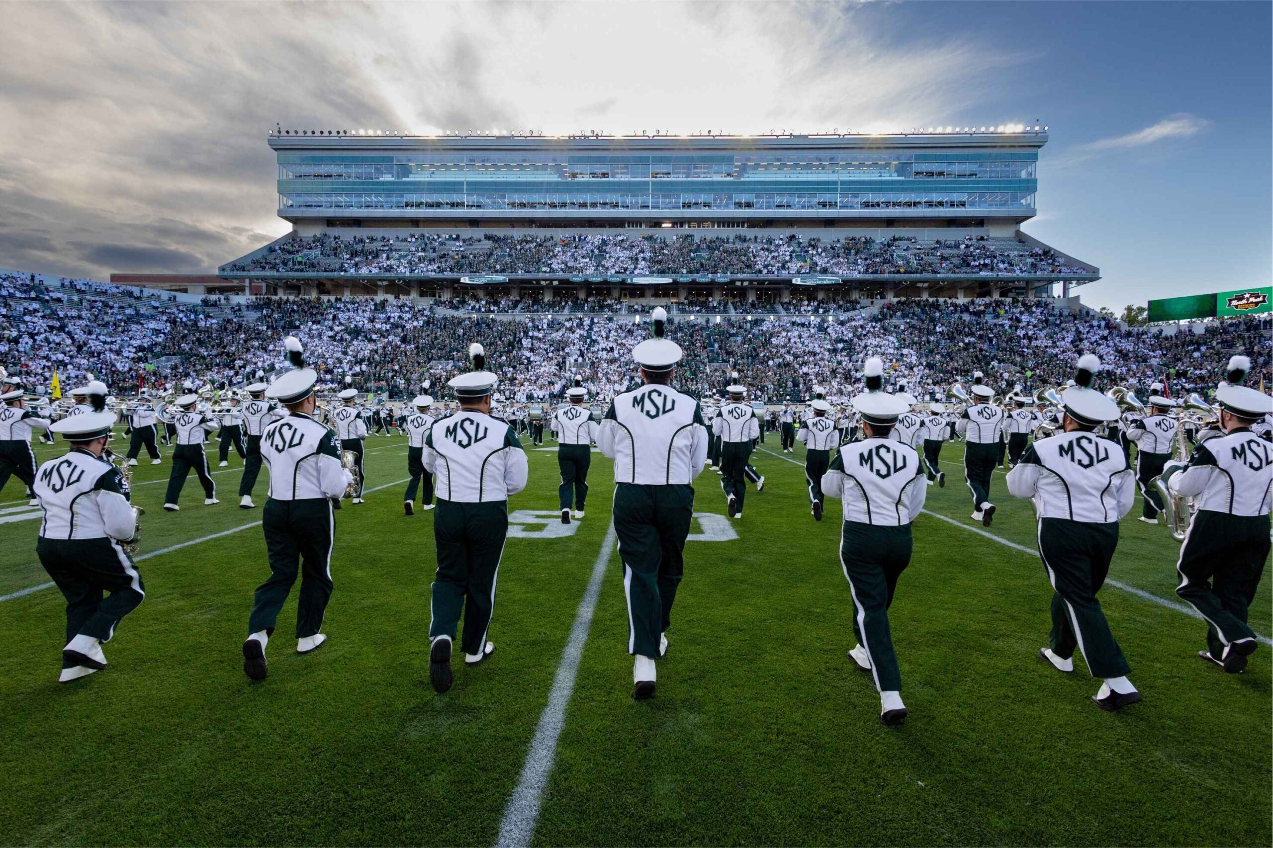Michigan State University marching band performs on the field at Spartan Stadium before a home football game in East Lansing.