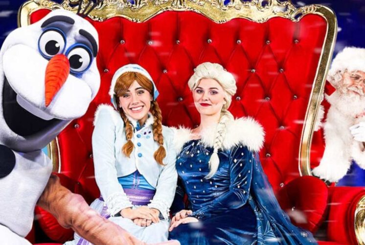 Frozen Christmas with Santa characters including a snowman mascot and two princess performers posing for families at Fairytale Fun Place event