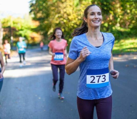 Participants run through the festive Christmas tree wonderland during the Holiday Hustle 5K at Blake’s Orchard & Cider Mill.