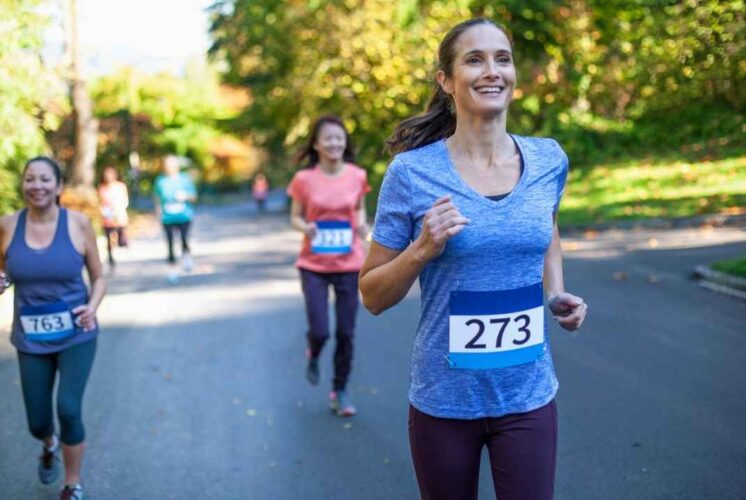 Participants run through the festive Christmas tree wonderland during the Holiday Hustle 5K at Blake’s Orchard & Cider Mill.