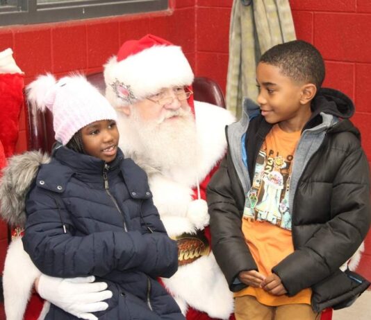 Holiday lights ceremony at Farmington Hills City Hall Santa visiting with kids during the Holiday lights ceremony in Farmington Hills with a kid friendly meet and greet atmosphere