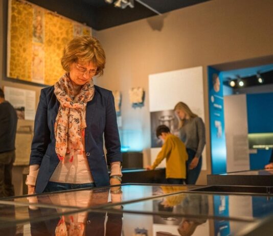 Visitors explore exhibits at Henry Ford Museum during Honoring Rosa Parks creating a reflective learning experience for families and kids