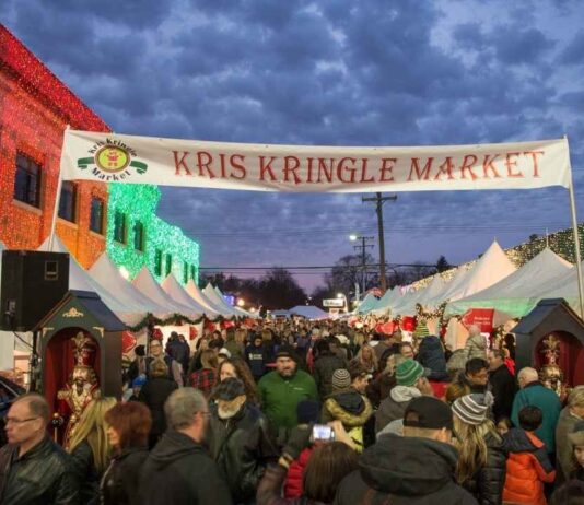 Crowds enjoy shopping, lights, and holiday fun at the Kris Kringle Market in Downtown Rochester during the festive Christmas weekend.