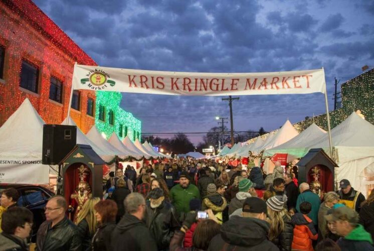 Crowds enjoy shopping, lights, and holiday fun at the Kris Kringle Market in Downtown Rochester during the festive Christmas weekend.