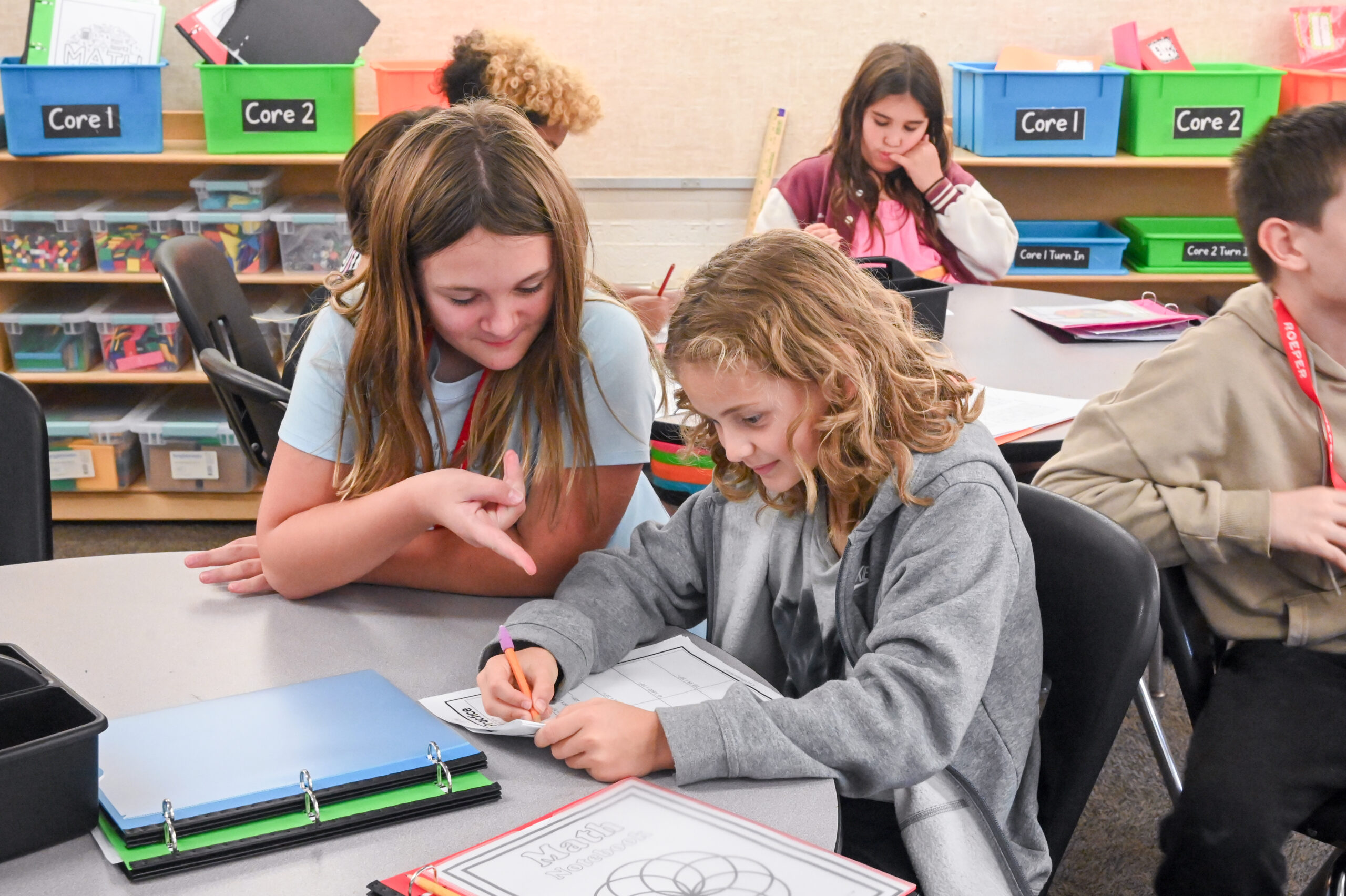 Two elementary students at The Roeper School work together on a classroom project, illustrating the school’s collaborative approach to gifted education.