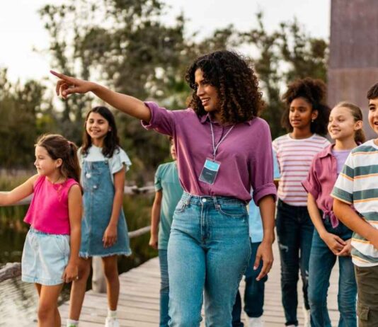 A group of kids and adults enjoy exploring the Detroit Zoo during Veterans Day, celebrating free admission for veterans and active-duty military.